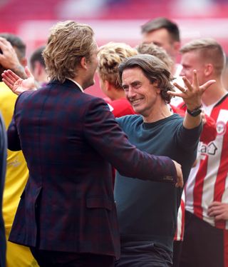 Thomas Frank, right, celebrates promotion at Wembley