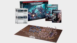Warhammer 40,000 Starter Set models and box content laid out on a plain background