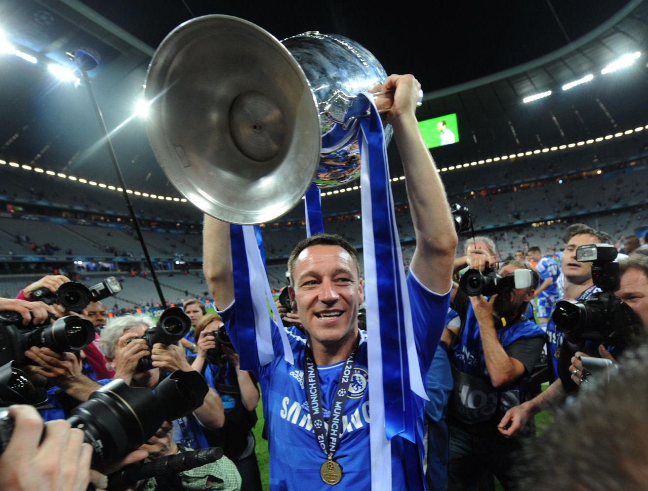 Chelsea captain John Terry holds the Champions League trophy aloft, 2012