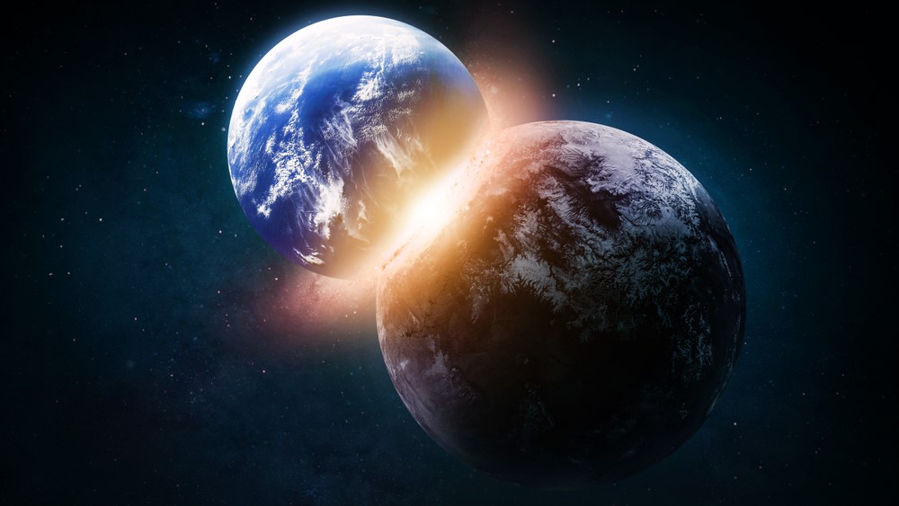 An artist's impression of two planets colliding into one another.
