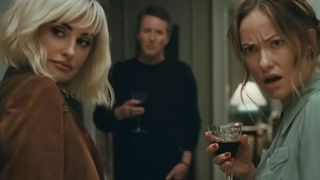 Olivia Wilde look shocked. Edward Norton and Penelope Cruz also look in The Invite.