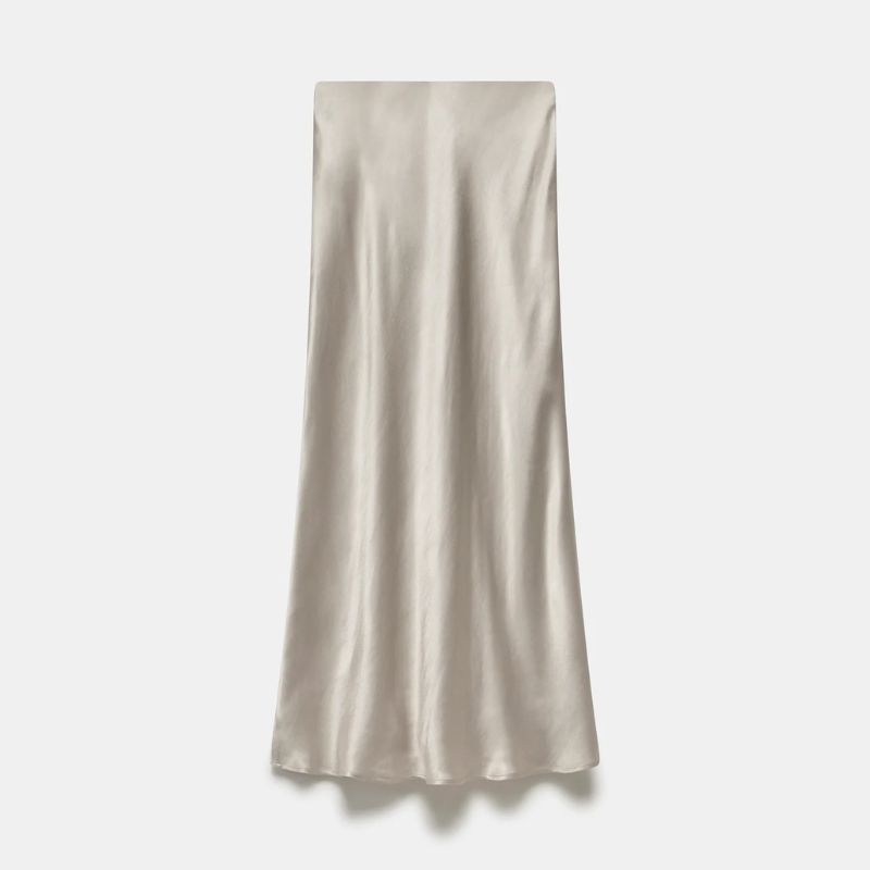 A cut out of a neutral silk bias cut skirt