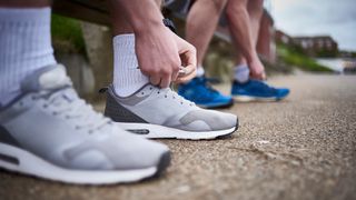 Running shoes how many miles: Image shows two men wearing running shoes