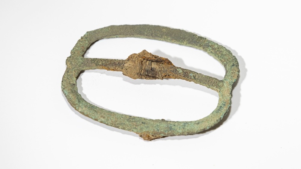 A military belt buckle found at the excavation site