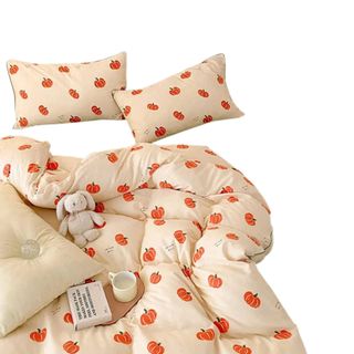 A fall bedding set with a pumpkin print