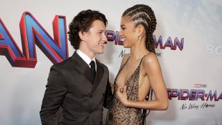 Getty image of Tom Holland and Zendaya staring lovingly at each other at a Spider-Man premiere.