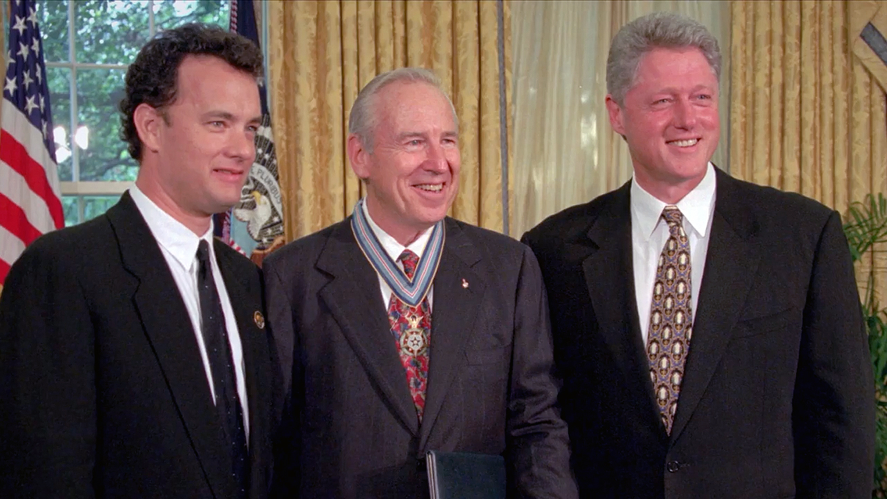 Apollo 13 mission commander Jim Lovell (at center), poses with Tom Hanks (left) and President Bill Clinton after being presented with the Congressional Space Medal of Honor.