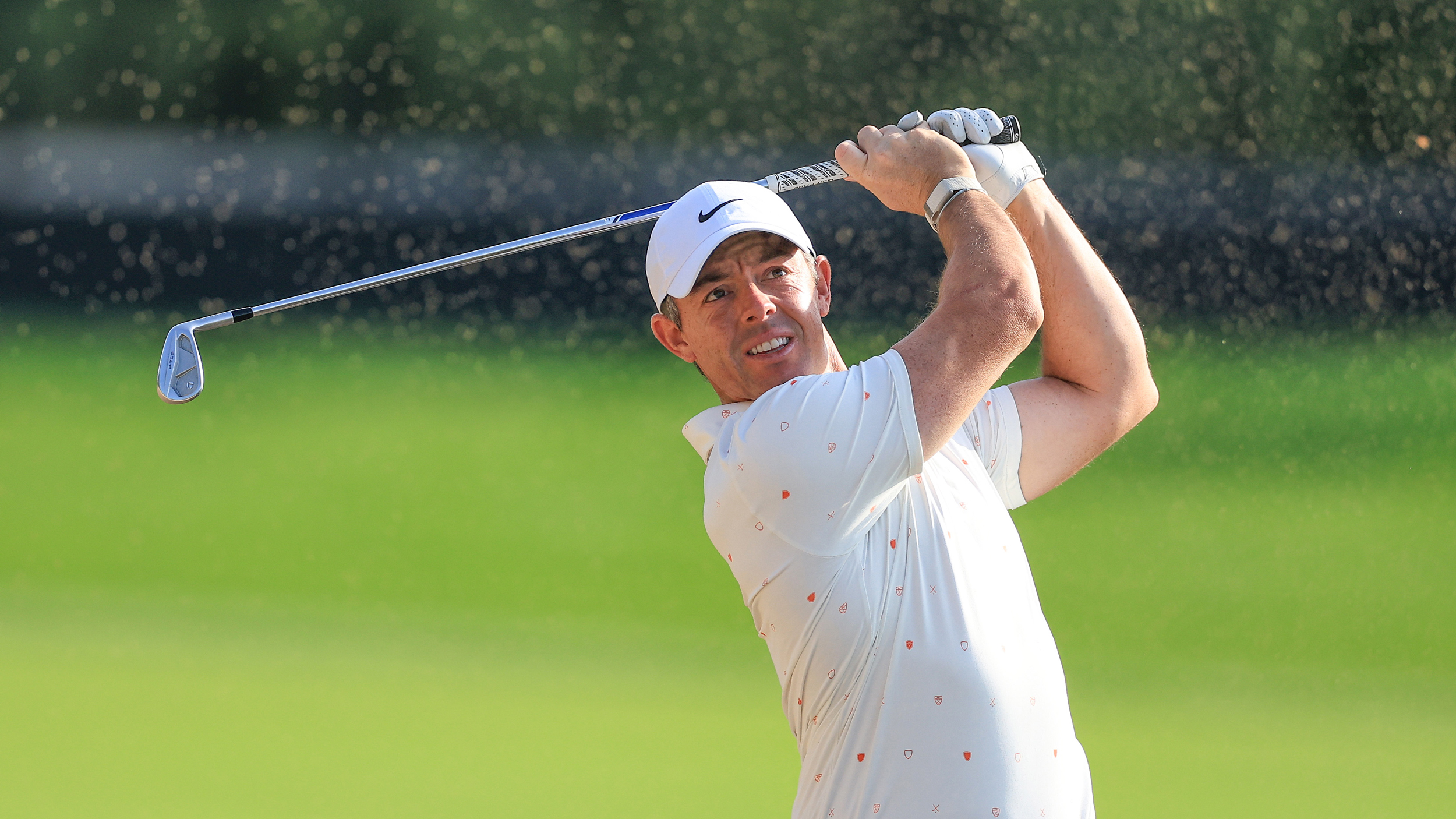 Rory McIlroy plays an iron shot during a practice round ahead of the 2026 Dubai Desert Classic