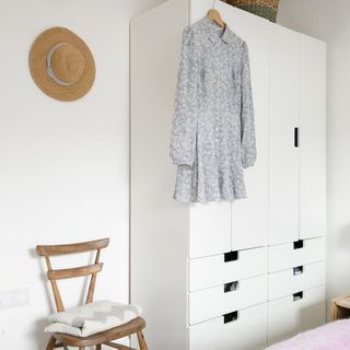 bedroom wardrobe with wooden chair and cap on all