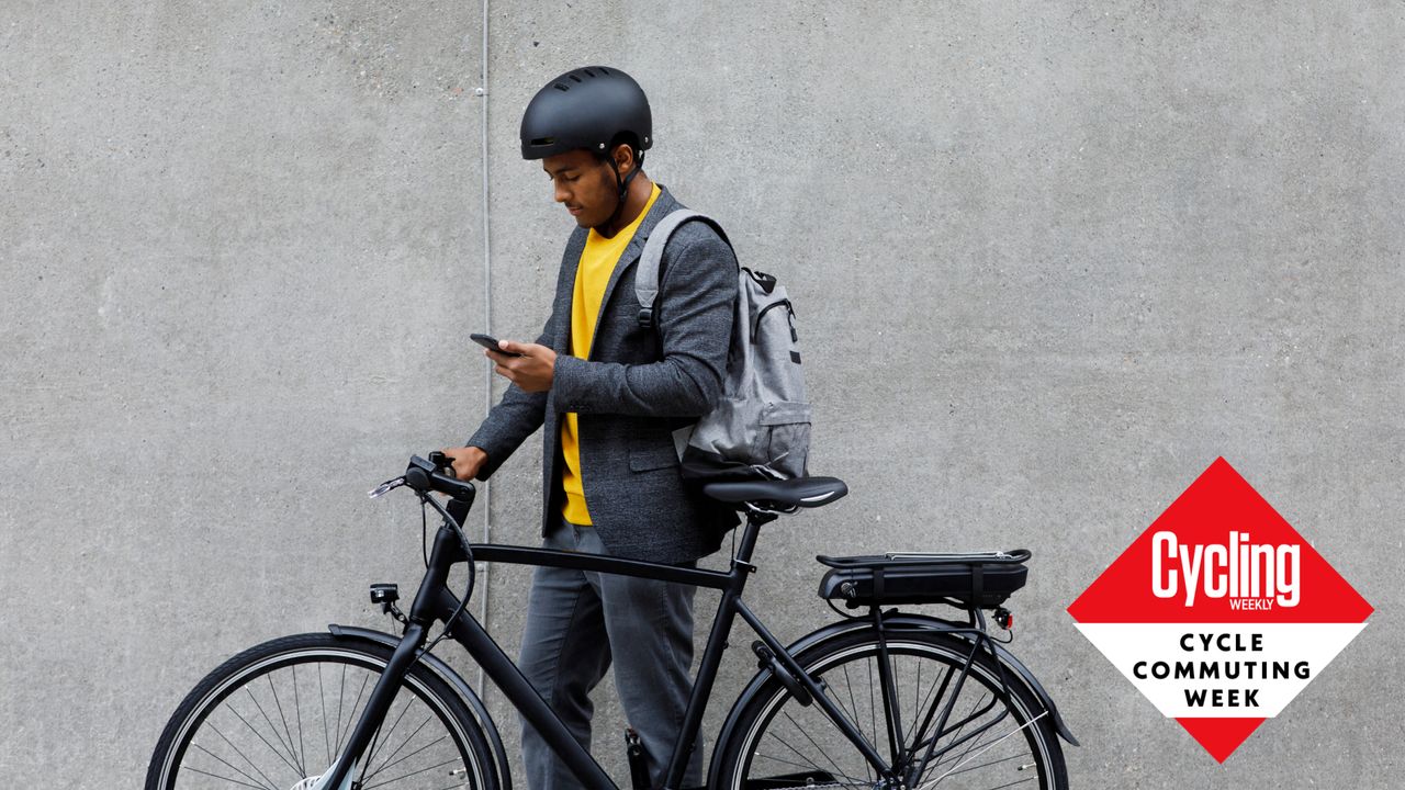 Image shows a man with his bike for commuting. 