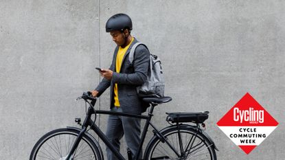 Image shows a man with his bike for commuting.