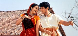 a man and woman dance on a roof in the movie lagaan