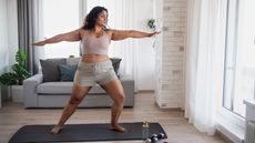 Woman performs low-impact workout at home