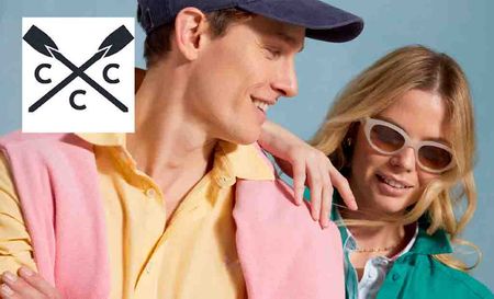 crew clothing logo top left with two models posing in colourful outfits