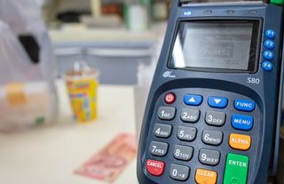 A PAX point of sale terminal in a store