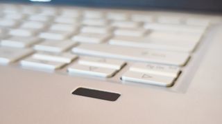 A silver Acer Swift 3 laptop on a light wooden desk