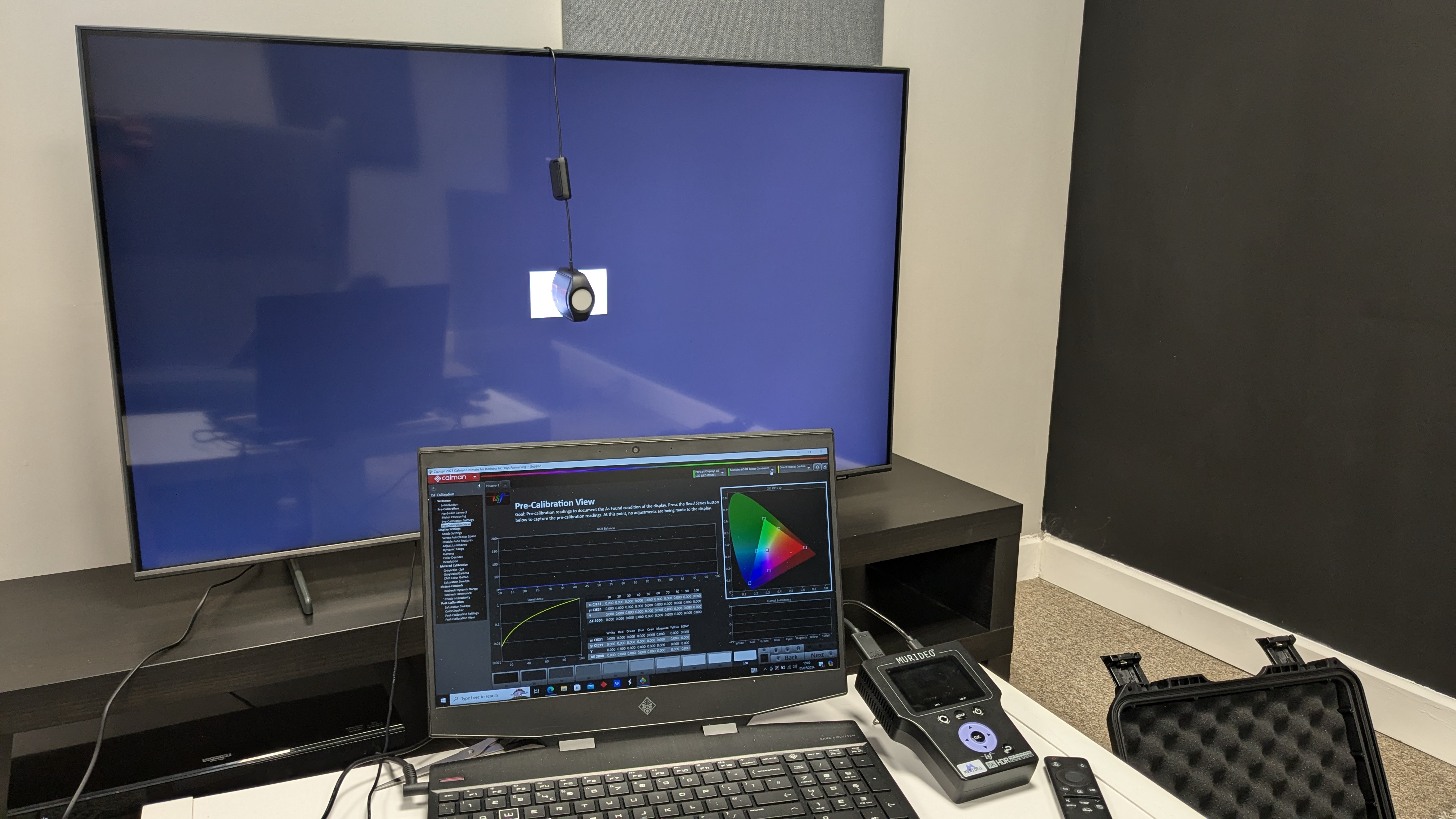 Samsung Q60D with testing equipment connected, including Portrait Displays' Calman color calibration software