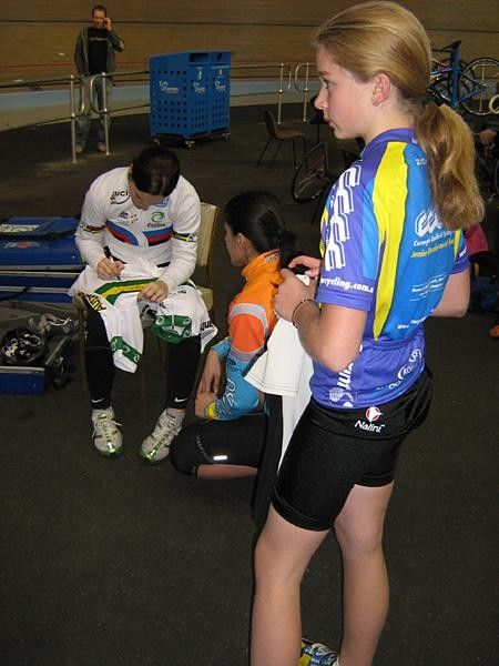 Anna Meares autographs a Cyclones jersey.