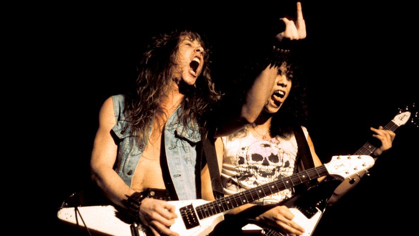 James Hetfield and Kirk Hammett performing live onstage, playing Gibson Flying V guitars