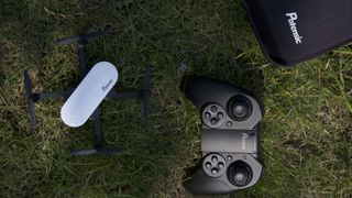 Potensic Elfin drone and controller on the grass