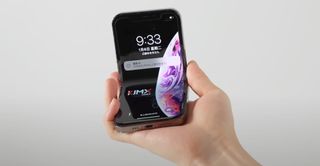 iPhone V foldable phone concept in hand