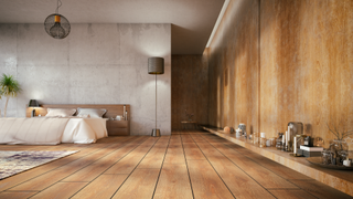 Bedroom with wide dark wooden floor boards