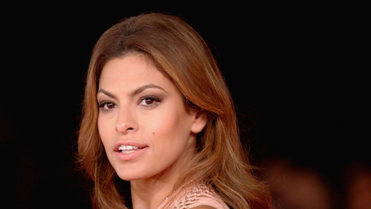 eva mendes on a black background