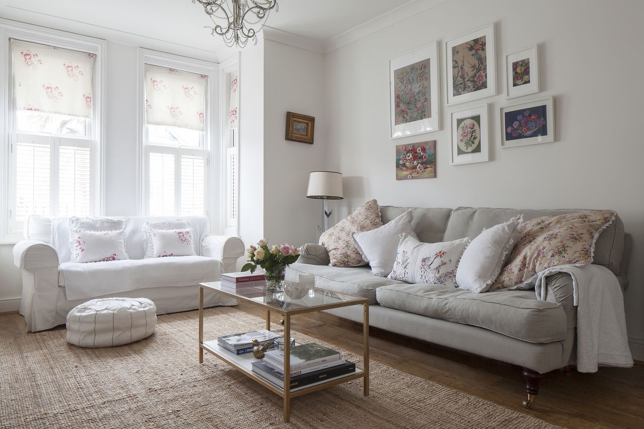 Climate change and sustainable furniture: Living room with grey and white furnishings and bay window