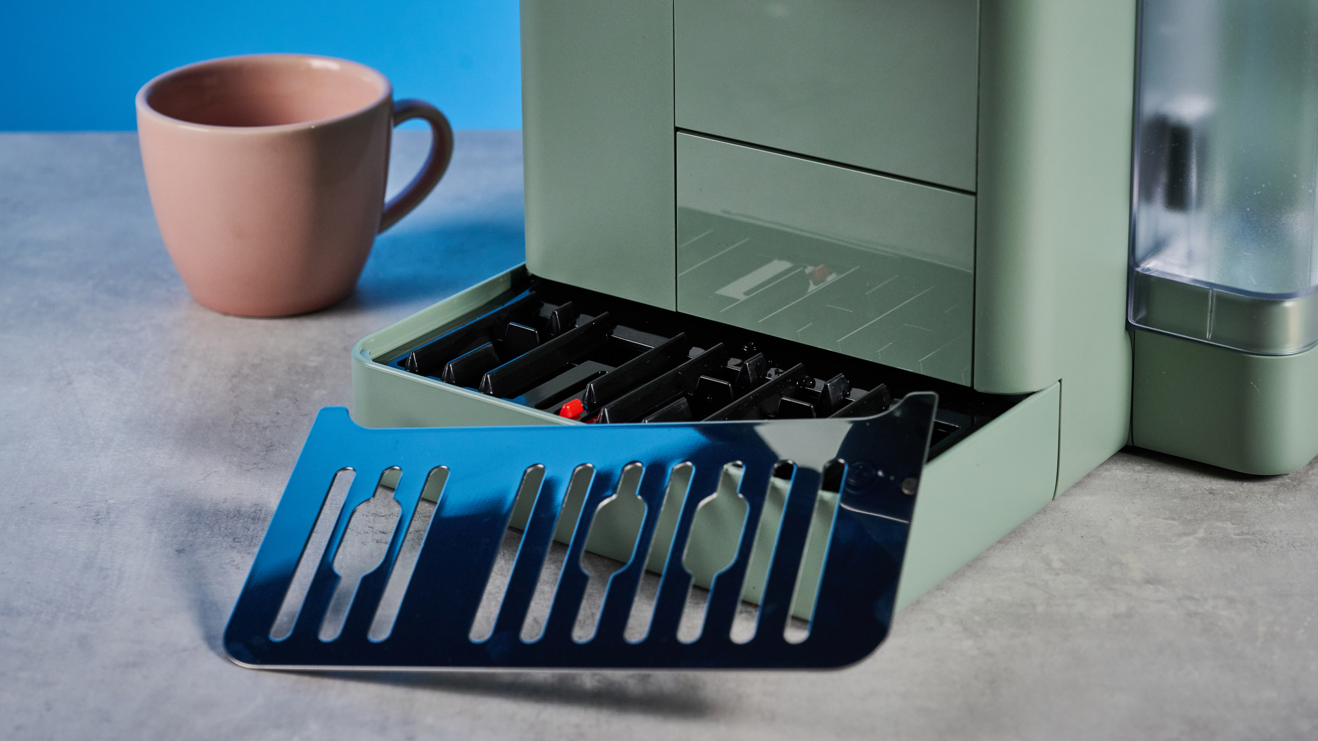 the de'longhi rivelia automatic superautomatic coffee machine in sage green with a bright LED screen, two interchangeable bean hoppers, an automatic milk frother, and a huge range of coffee recipes