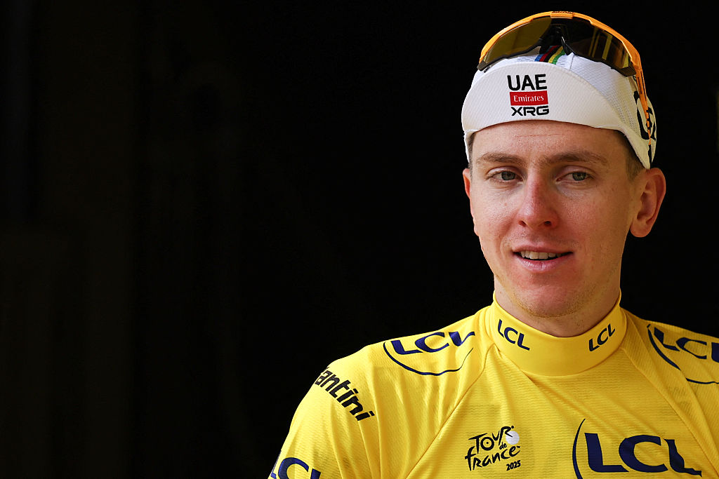 UAE Team Emirates - XRG team&#039;s Slovenian rider Tadej Pogacar celebrates on the podium with the overall leader&#039;s yellow jersey after the 15th stage of the 112th edition of the Tour de France cycling race, 169.3 km between Muret and Carcassonne, southwestern France, on July 20, 2025. (Photo by Anne-Christine POUJOULAT / AFP)