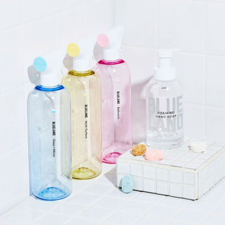 A pastel set of cleaning bottles and tabs