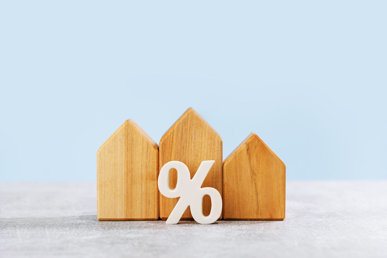 rendering of wooden houses with a percent sign in front