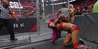 Sasha Banks after being powerbombed at Hell in a Cell 2016