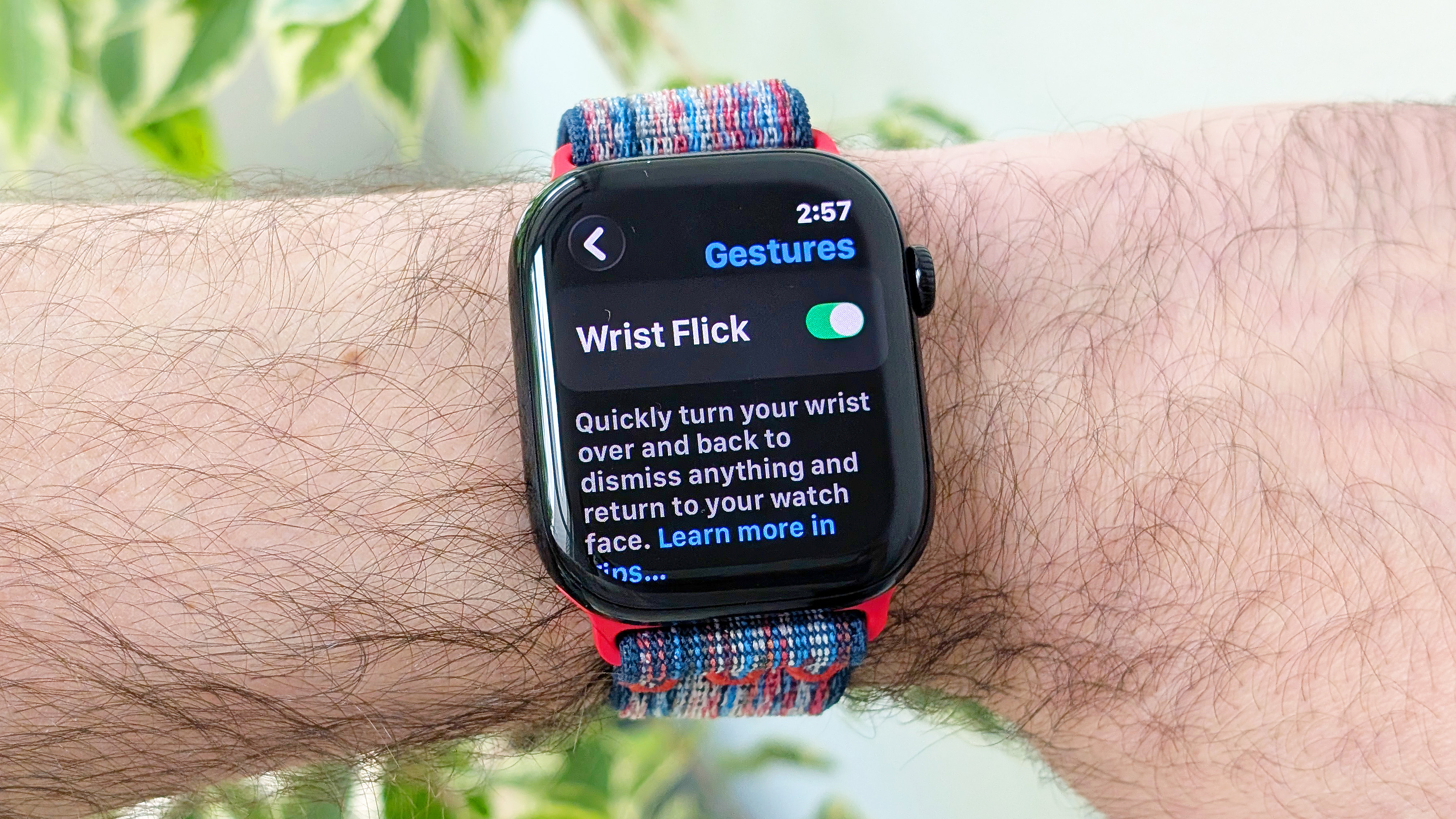 Close-up of the Apple Watch Series 10 on a user&#039;s wrist showing the new wrist flick gesture used to dismiss notifications hands free