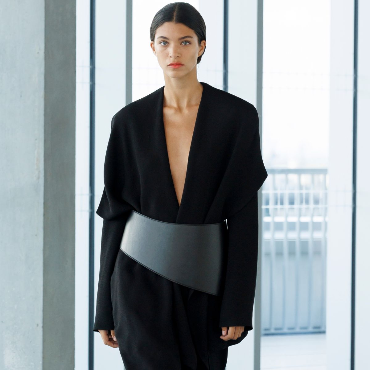 a model wearing a black tailored suit from tove&#039;s ss26 collection