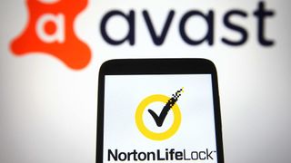 NortonLifeLock logo on smartphone with Avast logo in background