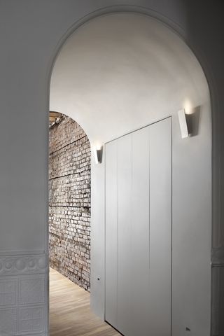 arched passageway with concealed doors