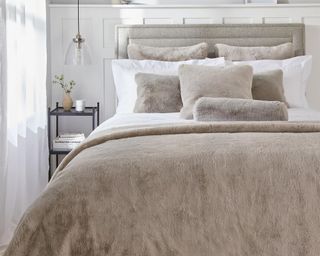 Super-Soft Faux-Fur Throw on bed in bedroom