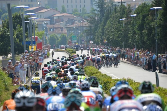 The peloton switches sides of the road