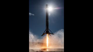 A Falcon 9 rocket booster seen landing on a pad at Vandenberg Space Force Base in California.