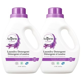 Two white bottles of liquid laundry detergent with purple caps and labels