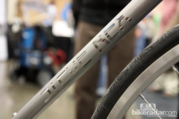 A popular technique at NAHBS was logos made using contrasting surface treatments.
