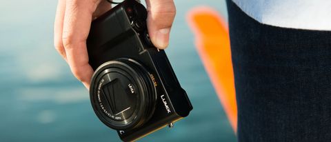 Panasonic Lumix ZS100 / TZ100 review: compact camera held in hand