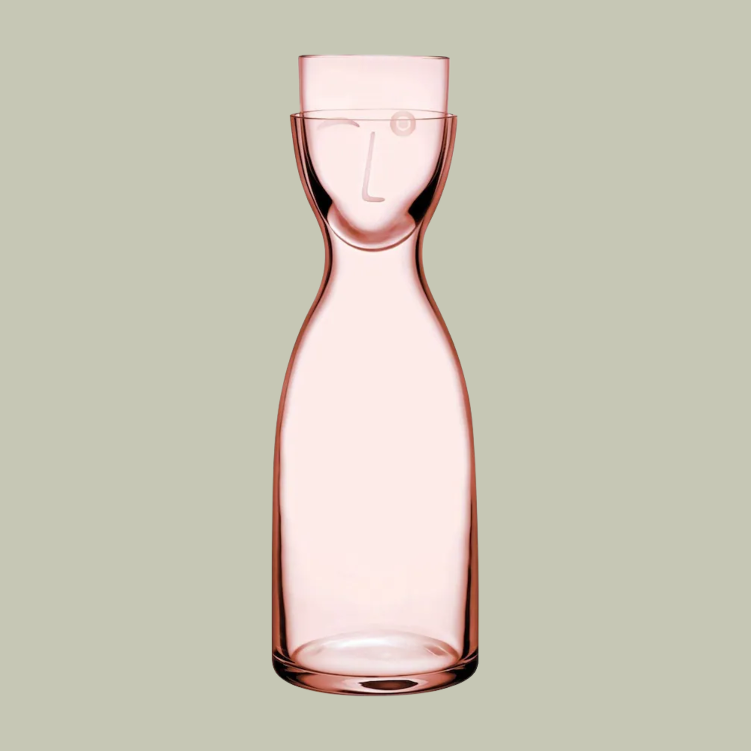 A clear pink carafe and cup