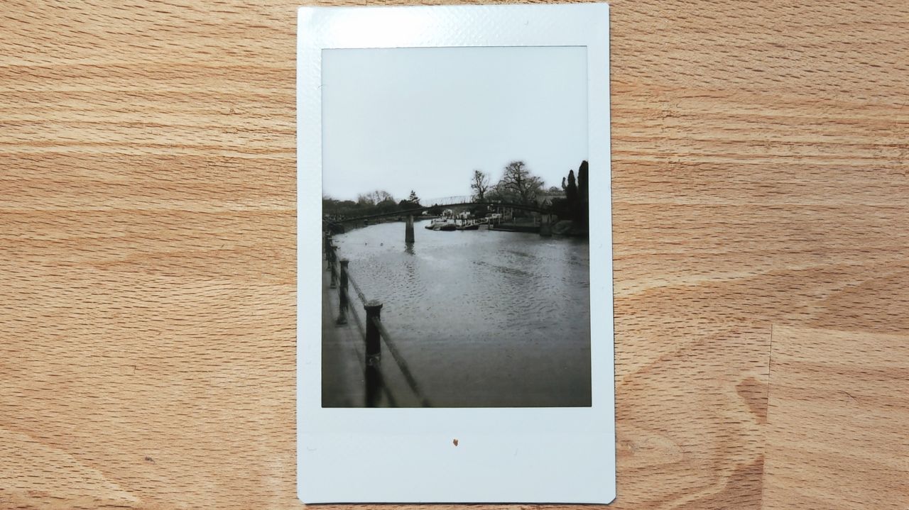 Instant photos on a wooden table