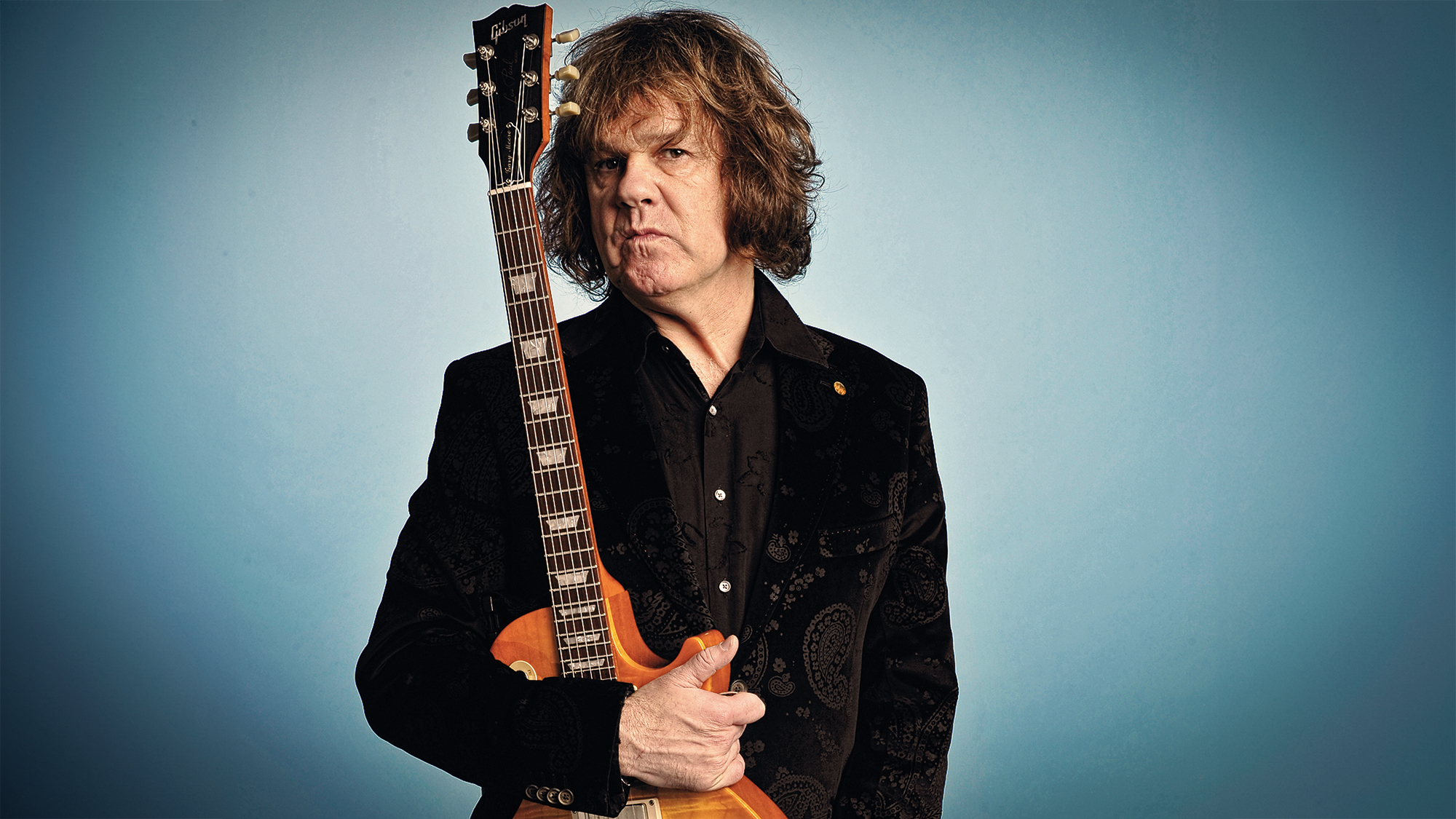 Gary Moore poses with the Les Paul he bought from Peter Green at a portrait shoot for Guitarist Magazine, November 20, 2008, London