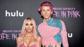 Megan Fox and Machine Gun Kelly posing at the Life in Pink premiere.
