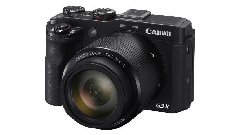 Canon compact camera against a white background