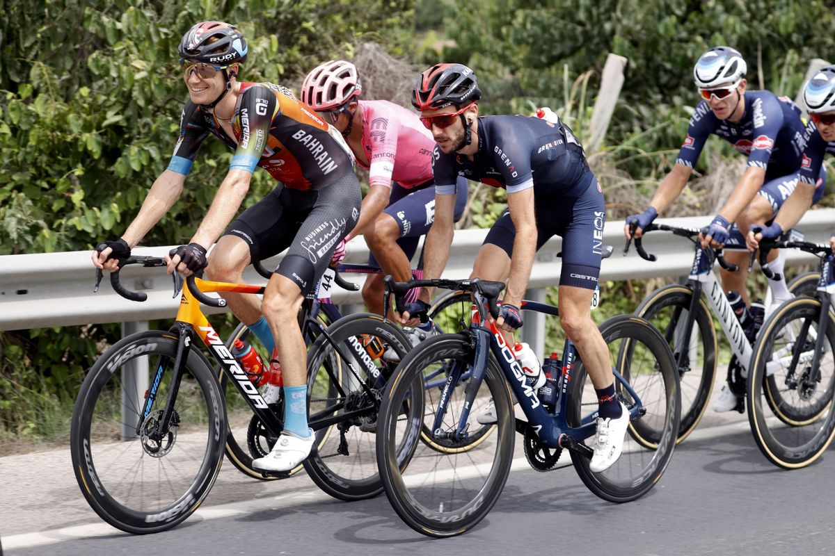 Jack Haig of Bahrain Victorious on stage 10 in front of Adam Yates (Ineos Grenadiers)