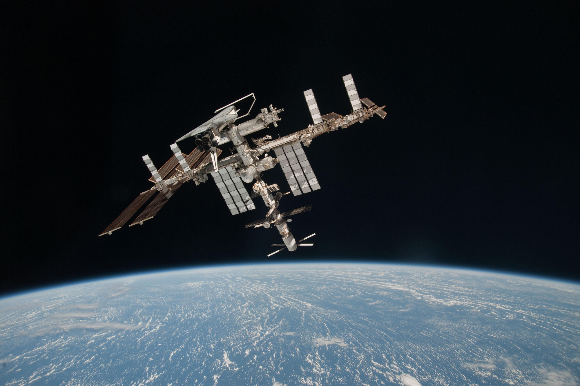 This photo is one of the first-ever views of a NASA space shuttle docked at the International Space Station as seen from a nearby Soyuz spacecraft. Station astronaut Paolo Nespoli snapped the photo on May 23, 2011 while the shuttle Endeavour was on its f